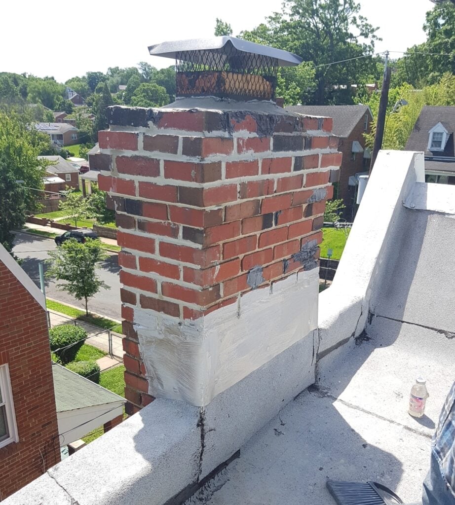 Spark Arrestors 101: Understanding, Installation, and Maintenance 4 Chimney at an exterior wall coincident with a parapet