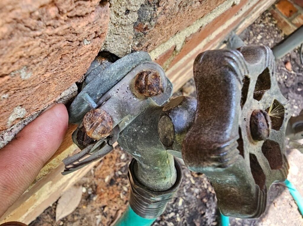 Spray Foam is NOT the Answer - Part III 7 half inch copper pipe passes through the brick exterior