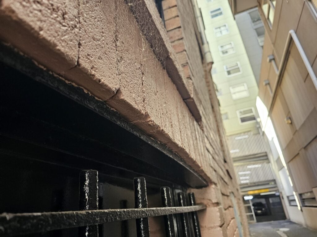 under the bricks of the header