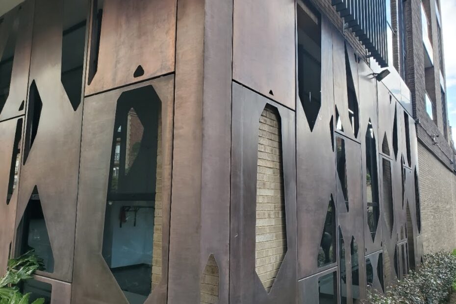 The real building envelope is the portion of the facade behind the steel panels - Brise Soleil Facade Walls