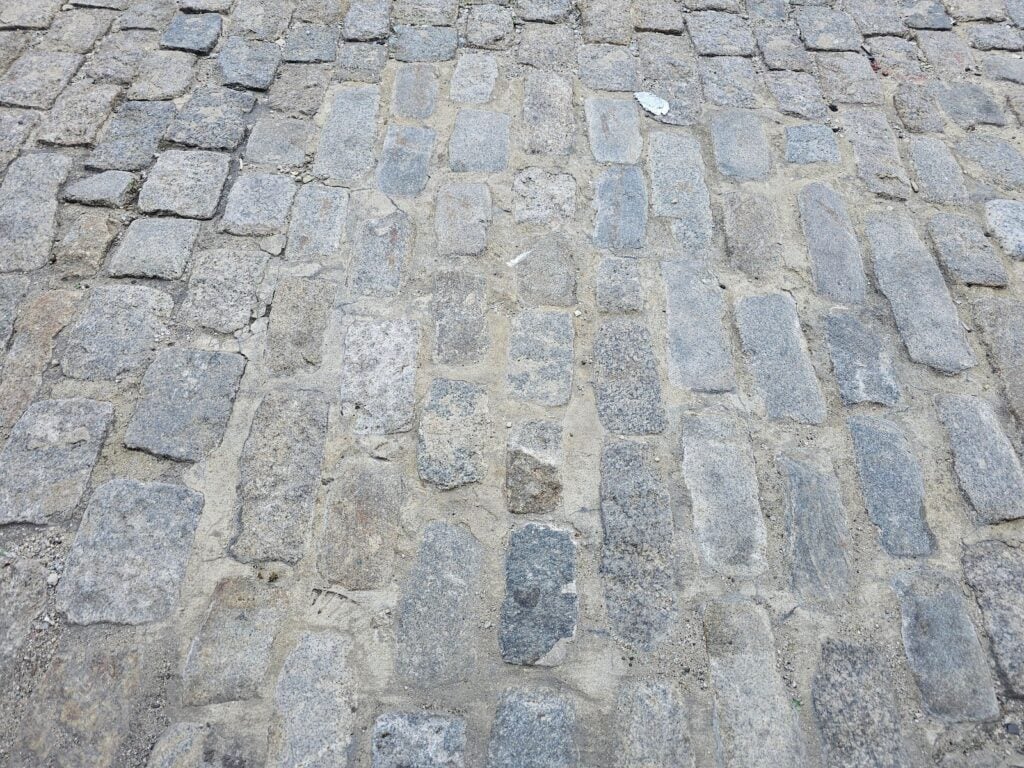 installed a cementitious mortar between the stones