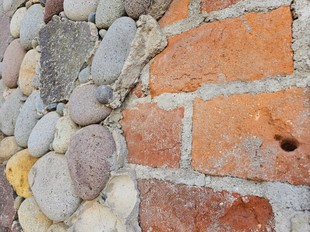 Decorative Rounded Rubble Stone Masonry - Part II 8 glued back to a brick wall surface