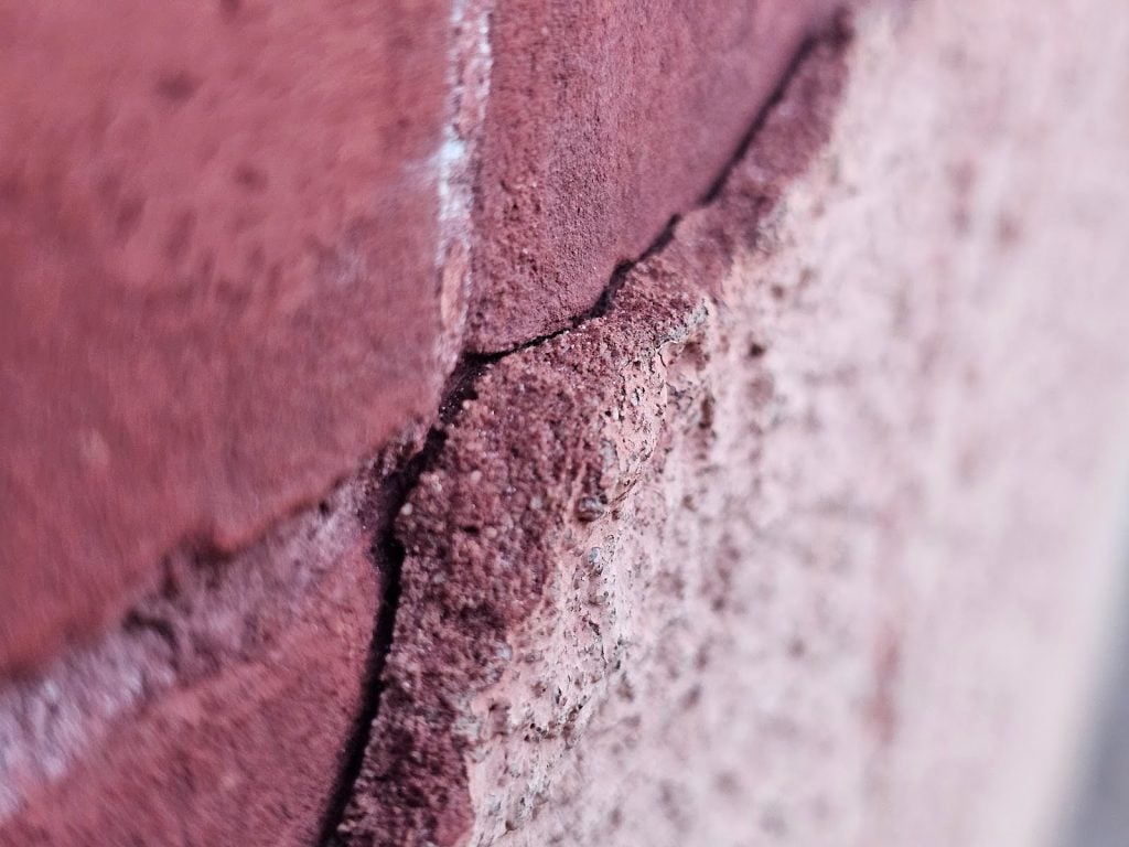 Close-up of Historic Brick with stucco damage – Washington DC