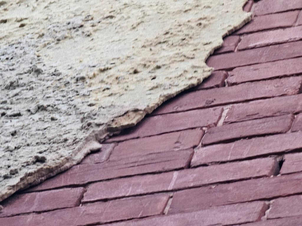 Stucco removal exposing Historic Brick layers – Washington DC