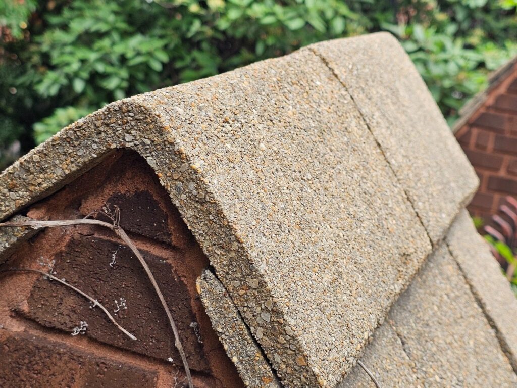Concrete shingles installed on column caps exterior detail