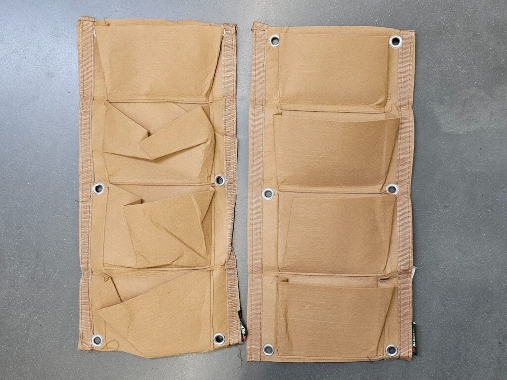 DIY plant bag arrangement inside brick wall niche