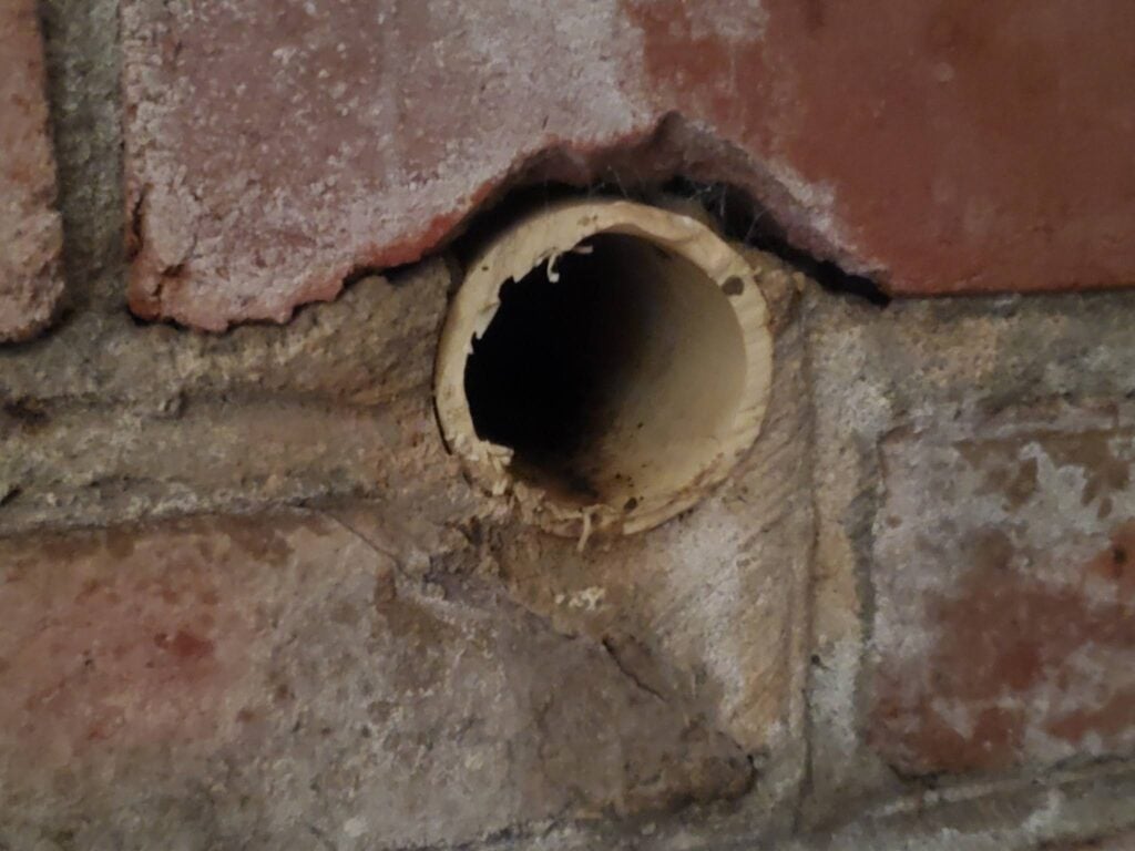 The weep at this location looks overly small in diameter and cut too close to the retaining wall. Its better practice to have tge pipe extend at least ¼" to avoid the bulk of the ground water from running down the face of the wall Areaway Drains in Washington dc area