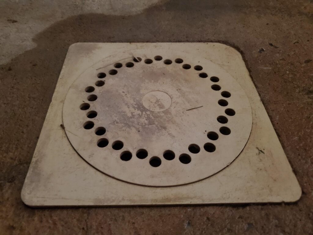 When you look close at a more modern PVC areaway drains there are several differences to historic drains. Historic drains were most often cast iron with a higher percentage of surface area open. common type of PVC area way drain
