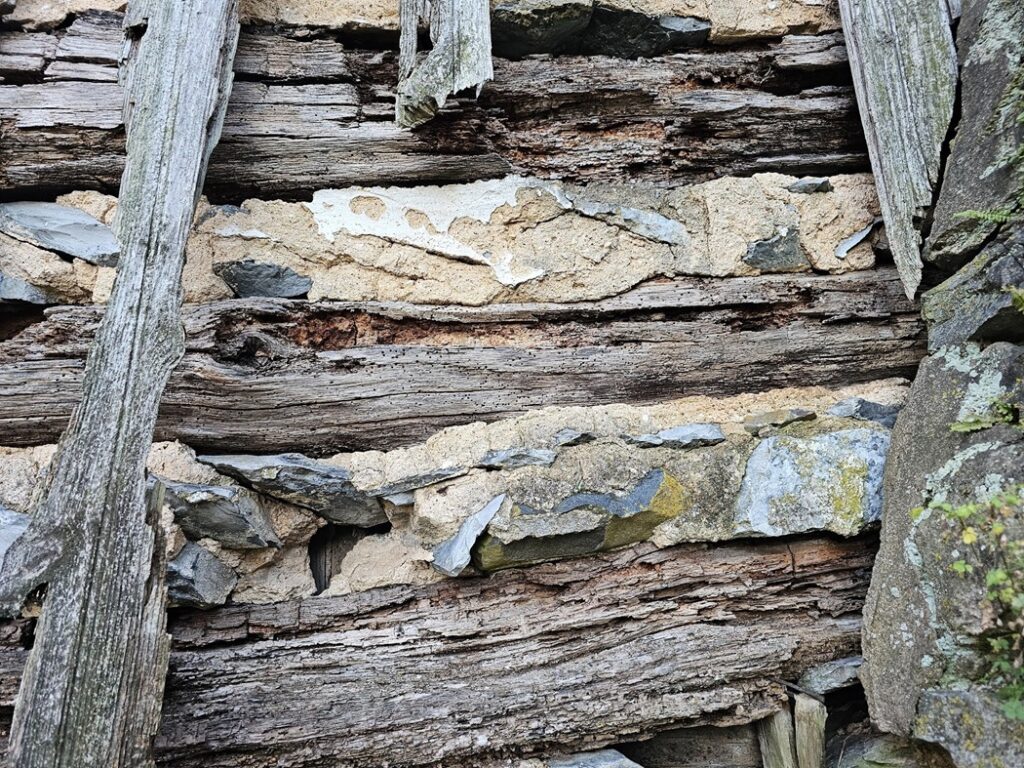 Historic Building with Wood together in Masonry - Part II 5 vertical siding has deteriorated