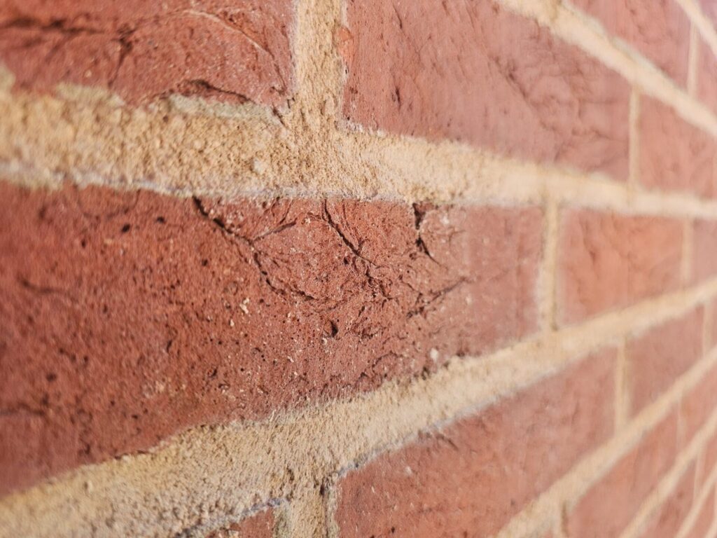 Close-up of historic brick masonry after professional tuckpointing and repointing work