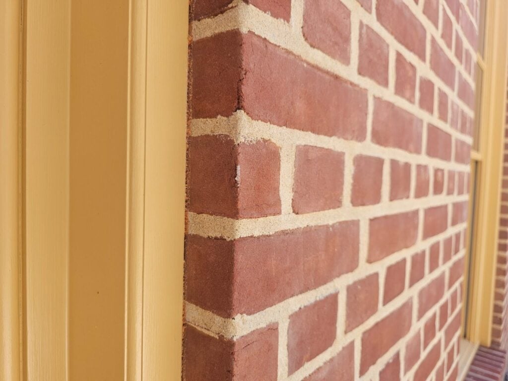 Natural woodwork and trim like this at the exterior masonry facades