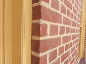 Natural woodwork and trim like this at the exterior masonry facades - Repointed Historic Brick