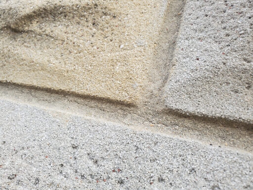 Formstone Coverings over Historic Brick - Part I 5 Original brick revealed beneath deteriorating Formstone cladding during masonry restoration in Washington, DC