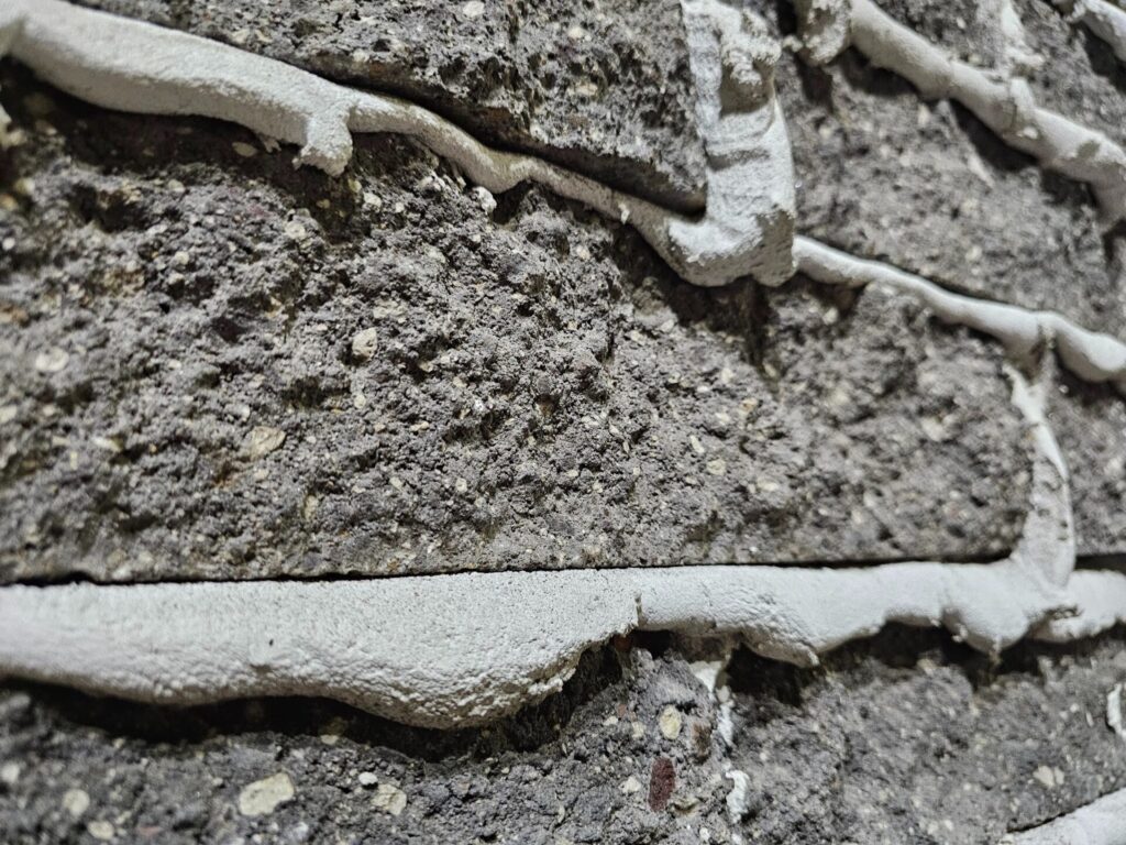 Extruded Mortar Joints - Part I 3 Close-up of extruded mortar joint profile in brickwork